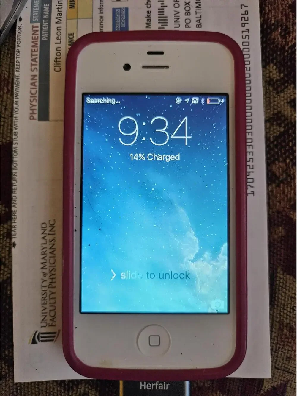 Apple iPhone 3 (i think) - White- charges and powers on. Working.